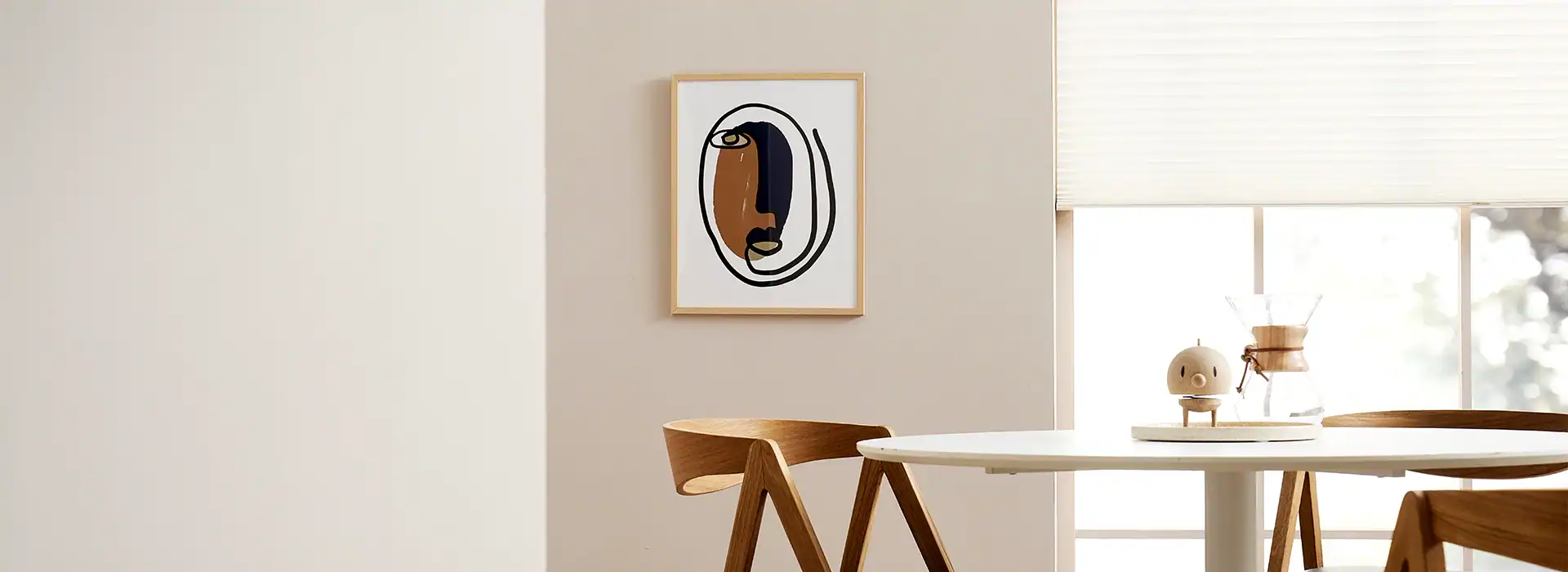 A white dining room table with four chairs.